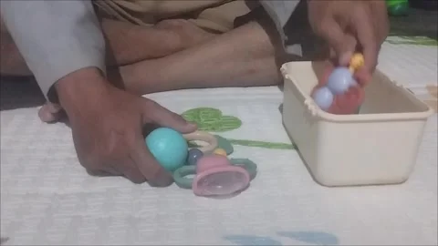 The baby's little bite toy is put in the box Stock Footage 290985207