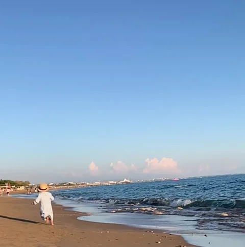 Baby's run along the seashore Stock Footage 235434559