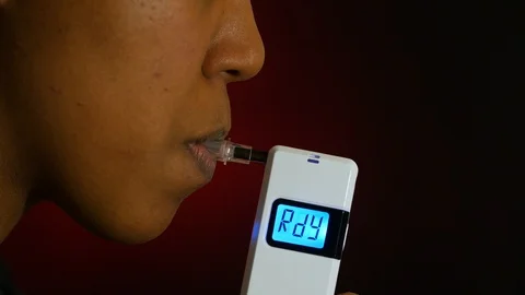 BAC test with a breathalyzer Stock Footage 104973234
