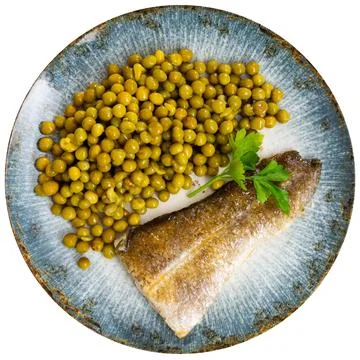 Bacalao cod with green peas on a ceramic plate Stock Photos