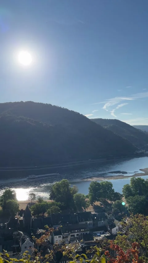 Bacharach, Germany, August 11, 2026 selective focus on cargo vessel passing.. Stock Footage 345202356