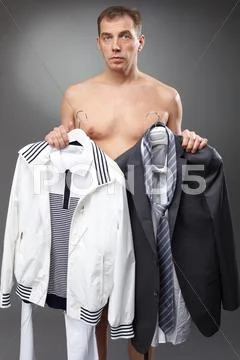 Bachelor holding clothes at morning Stock Photos