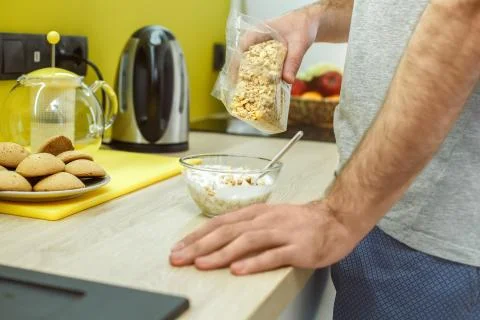 Bachelor man daily routine in the kitchen single lifestyle concept cooking Stock Photos