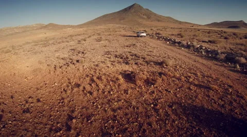 Back aerial view of a 4 by 4 car through the desert. Spain. 4k Stock Footage 44786330