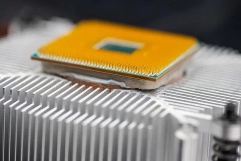 Back of a AMD socket AM4 CPU mounted on a cooler 库存照片