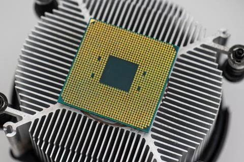 Back of a AMD socket AM4 CPU mounted on a cooler Stock Photos