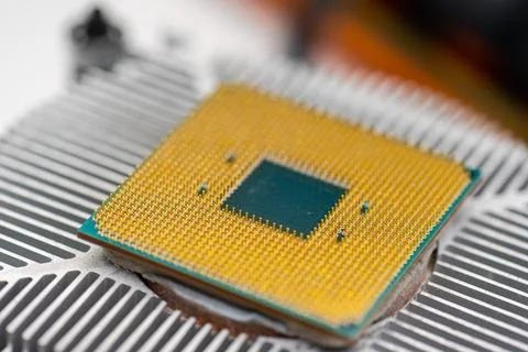 Back of a AMD socket AM4 CPU mounted on a cooler 库存照片