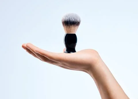Back and forth effortlessly. an unrecognizable man holding a brush against a Stock Photos