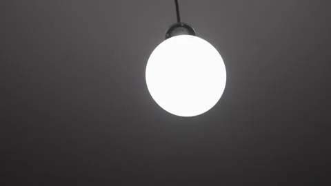 Back and forth moving light bulb. Stock Footage 322122899