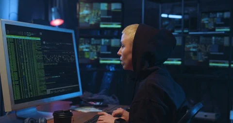 Back and side view on female Caucasian cyberpolice officer working on computer Stock Footage 126349209