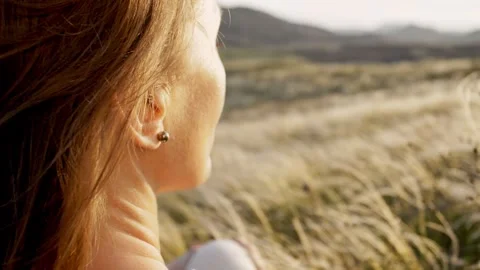 Back and side view slow motion close up of a woman admiring the mountain Stock Footage 241650419