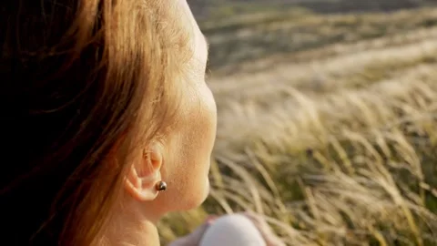 Back and side view slow motion close-up of a woman admiring the mountain Stock Footage 241650545