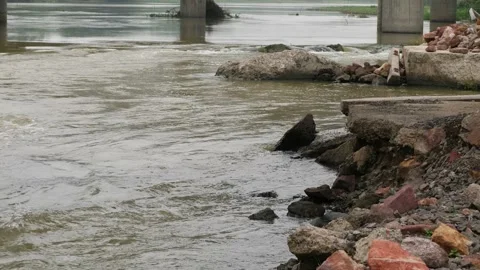 Back angle capture of rocks, pillars and a rushing river Stock Footage 225738724