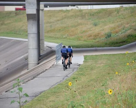 Back angle shot of a cyclist Stock Photos