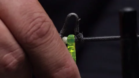 Back of arrow being snapped into place on bow string Stock Footage 148868118