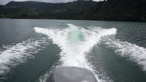 Back of boat with engine running on lake tarawera, new zealand Stock Footage 220863150