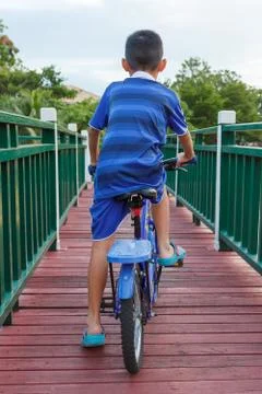 Back of the boy biking. Stock-Fotos