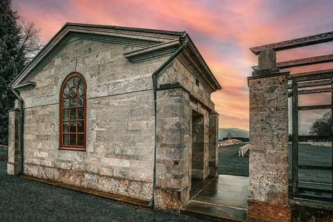 The back of the building in front of the cemetery. Stock Photos