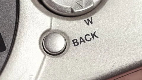 Back Button Pressed On Silver Digital Camera Panel Stock Footage 332974947