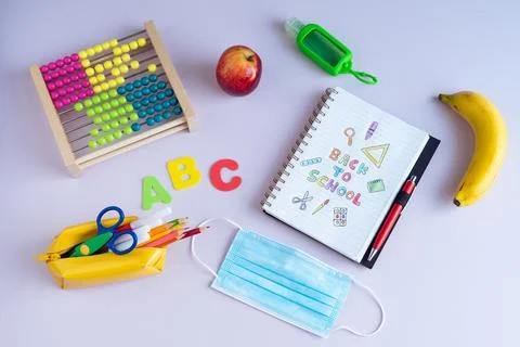 Back to class. Notebook with text and various complements. Stock Photos