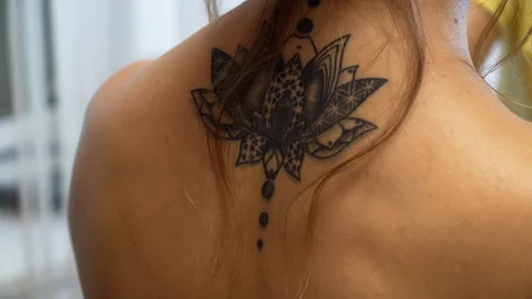 Back closeup view of a makeup artist makes an evening make-up for a model 動画素材 127501042