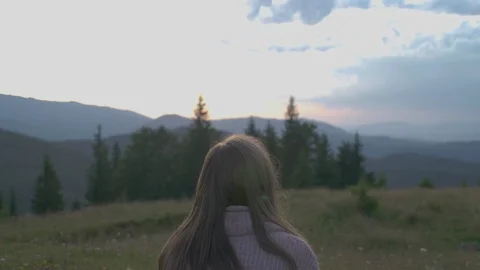 Back conceptual shot of young attractive girl millenial tourist sitting in Stock Footage 119968097