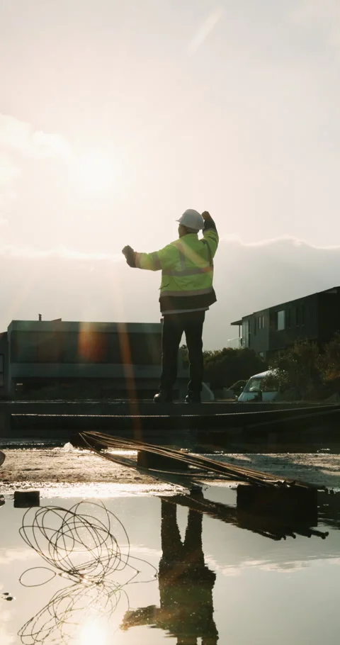 Back, construction or man in celebration on site for foundation finish Stock Footage 336230695