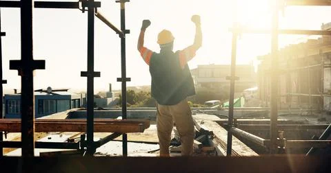 Back, construction site and man with celebration for foundation finish, ins.. Stock Photos