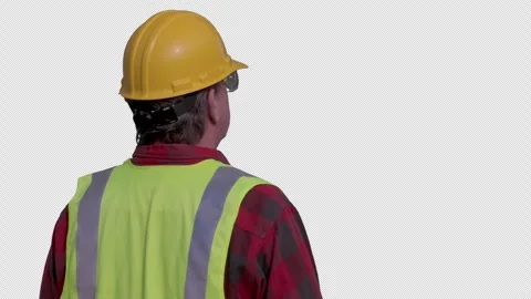 Back of Contractor Wearing Hard Hat, Safety Goggles and Vest Overseeing Project Stock Footage 320269403