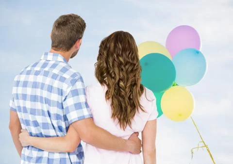 Back of couple looking at balloons 스톡 사진