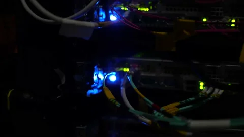 Back data server connectors with fiber optic patch cables at cloud Video stock 228940565
