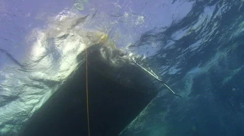 Back deck of dive boat in ocean swell - underwater view Stock Footage 571808