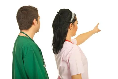 Back of doctors pointing away Stock Photos