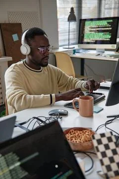 Back End Developer Listening to Music Stock Photos