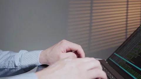 Back end developer working in computer in IT office, sitting at desk writing Stock Footage 183343325