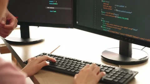 Back end or software developer manager supervising coding. Burgeoning Stock Footage 262111215