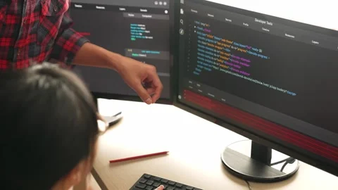 Back end or software developer manager supervising coding. Burgeoning Stock Footage 263085952