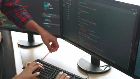 Back end or software developer manager supervising coding. Burgeoning Stock Footage 263515269