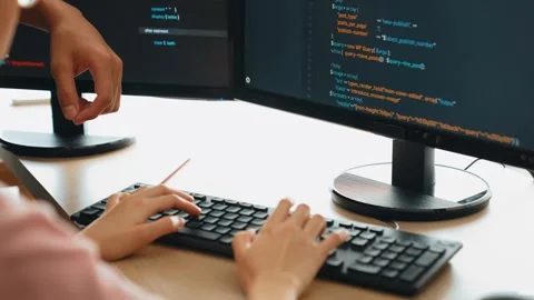 Back end or software developer manager supervising coding. Burgeoning Stock Footage 264925488