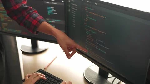 Back end or software developer manager supervising coding. Burgeoning Stock Footage 268135411