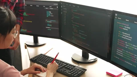 Back end or software developer manager supervising coding. Burgeoning Stock Footage 268681850