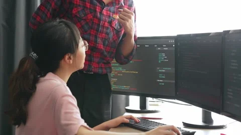 Back end or software developer manager supervising coding. Burgeoning Stock Footage 270402115