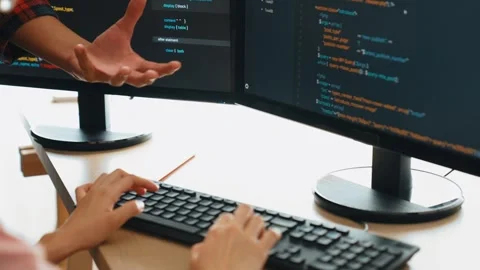 Back end or software developer manager supervising coding. Burgeoning Stock Footage 276357151