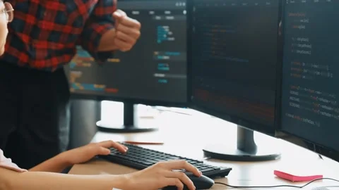 Back end or software developer manager supervising coding. Burgeoning Stock Footage 277096611