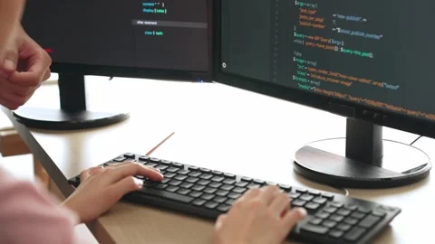 Back end or software developer manager supervising coding. Burgeoning Stock Footage 277958215