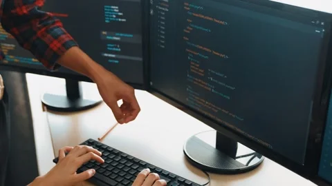 Back end or software developer manager supervising coding. Burgeoning Stock Footage 280073586