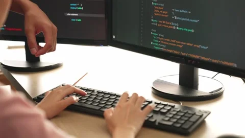Back end or software developer manager supervising coding. Burgeoning Stock Footage 281597492