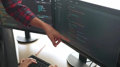Back end or software developer manager supervising coding. Burgeoning Stock Footage 283135464