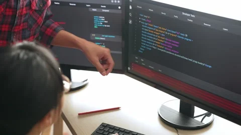 Back end or software developer manager supervising coding. Burgeoning Stock Footage 283224812
