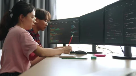 Back end software developer engineer writing code. Burgeoning Stock Footage 264588740